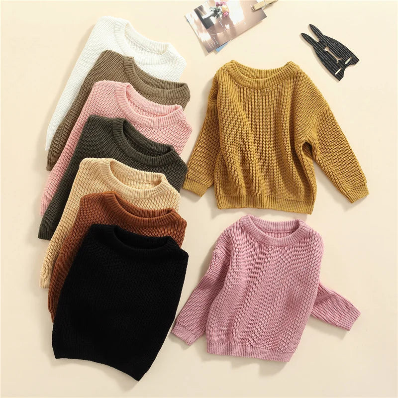 Neutral colored knitted sweaters