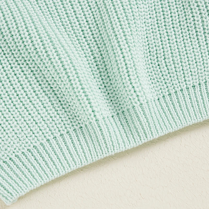 Neutral colored knitted sweaters