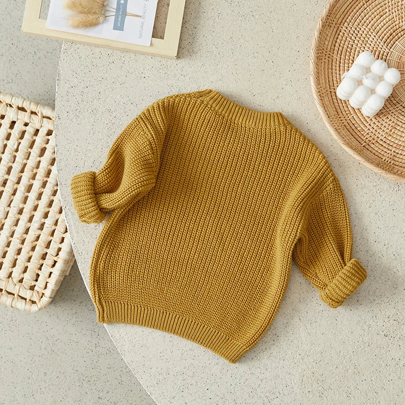 Warm colored knitted sweaters