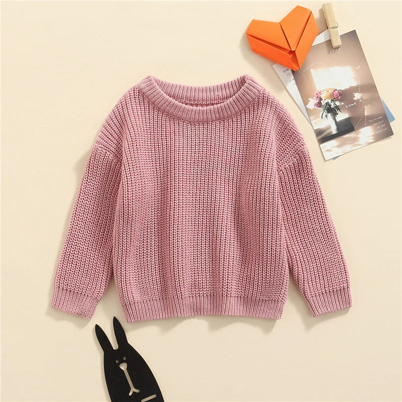 Neutral colored knitted sweaters