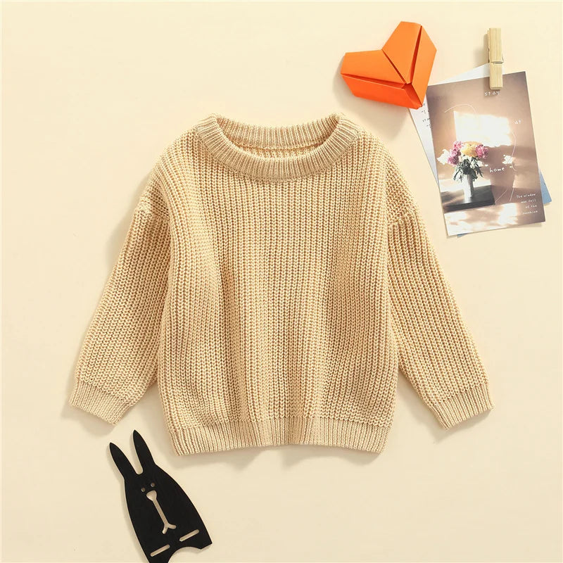 Neutral colored knitted sweaters