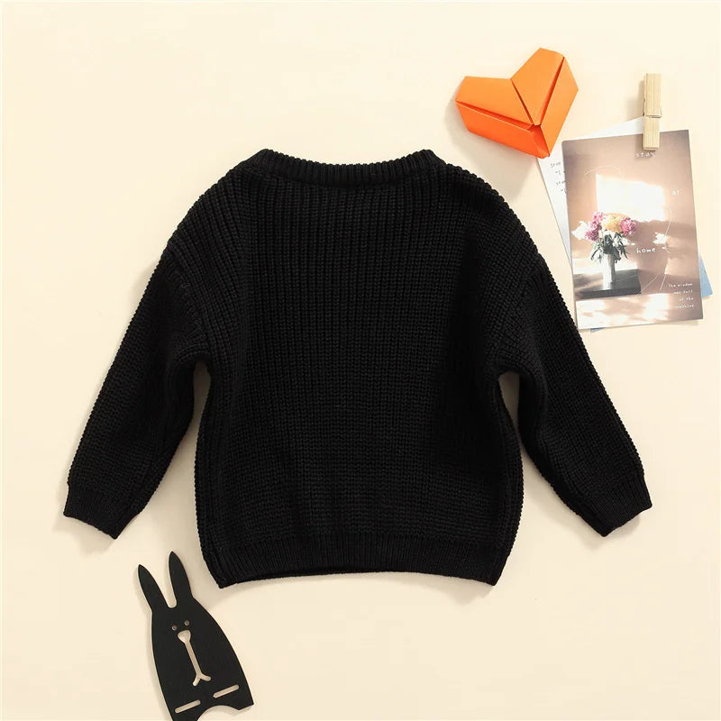 Neutral colored knitted sweaters