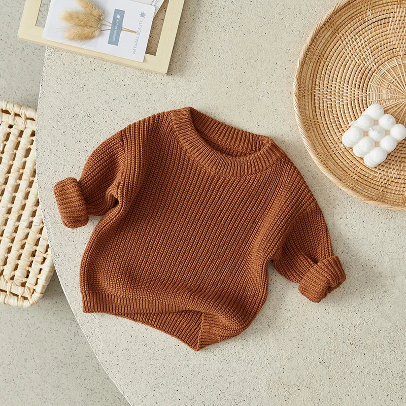 Neutral colored knitted sweaters