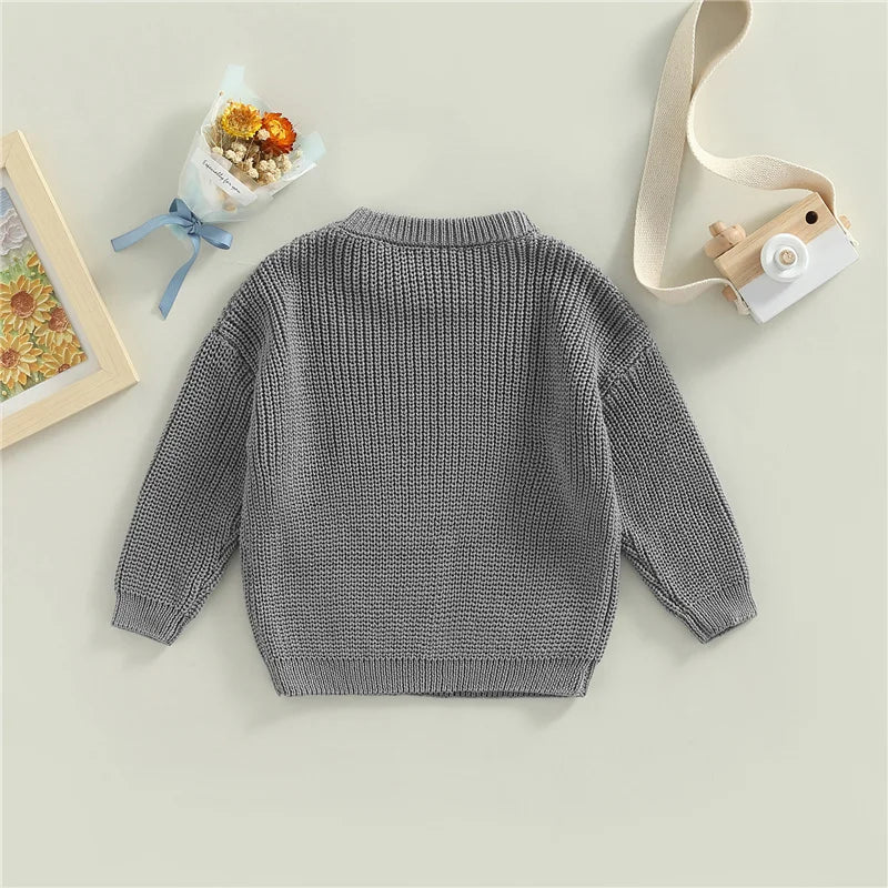 Neutral colored knitted sweaters