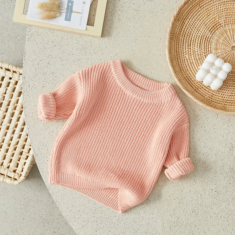 Neutral colored knitted sweaters