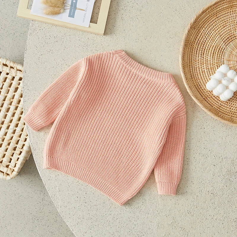 Neutral colored knitted sweaters