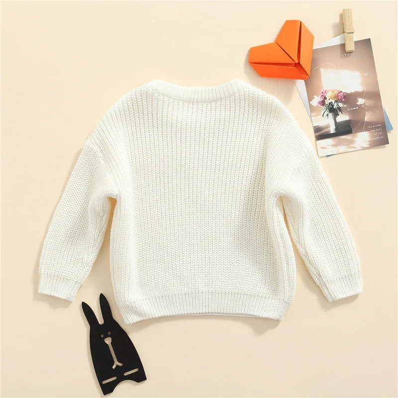 Neutral colored knitted sweaters