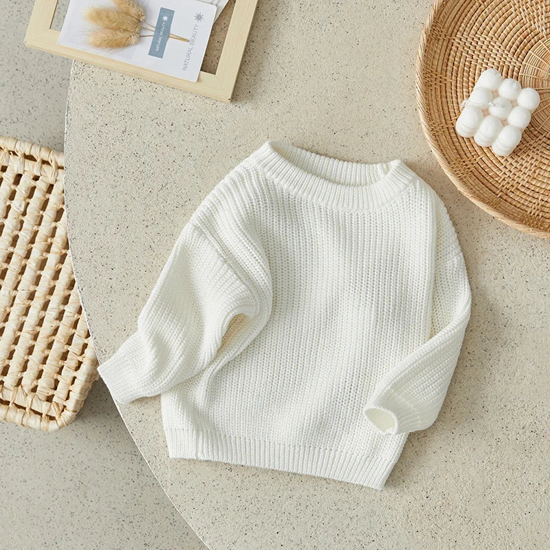 Neutral colored knitted sweaters
