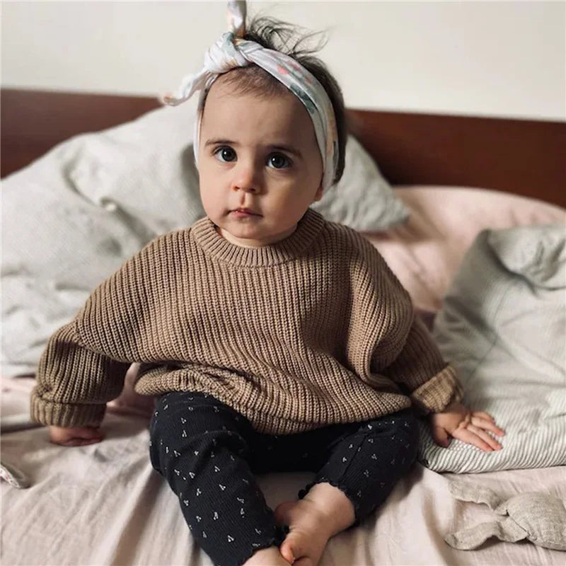 Neutral colored knitted sweaters