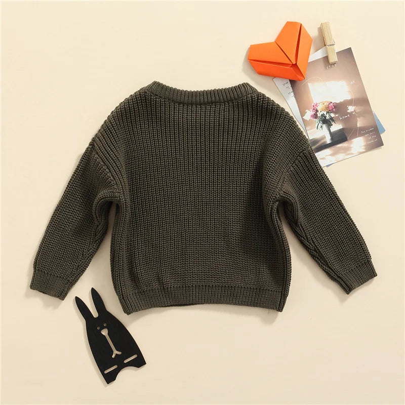 Neutral colored knitted sweaters