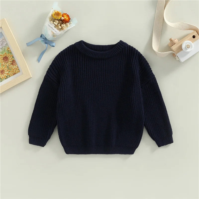 Neutral colored knitted sweaters