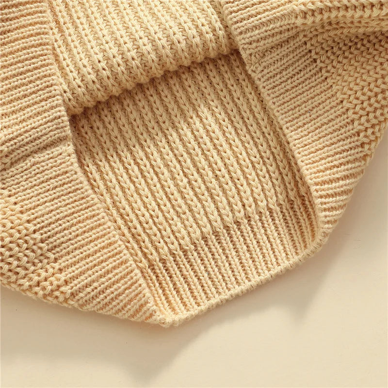 Neutral colored knitted sweaters