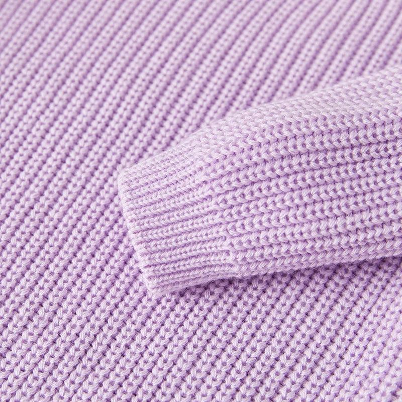 Neutral colored knitted sweaters