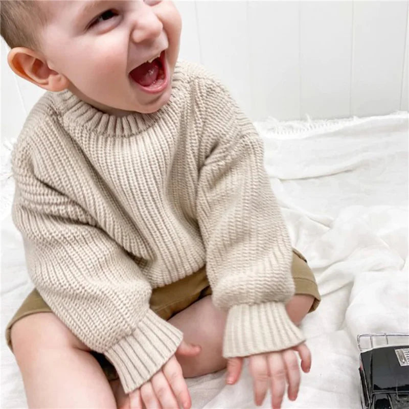 Neutral colored knitted sweaters