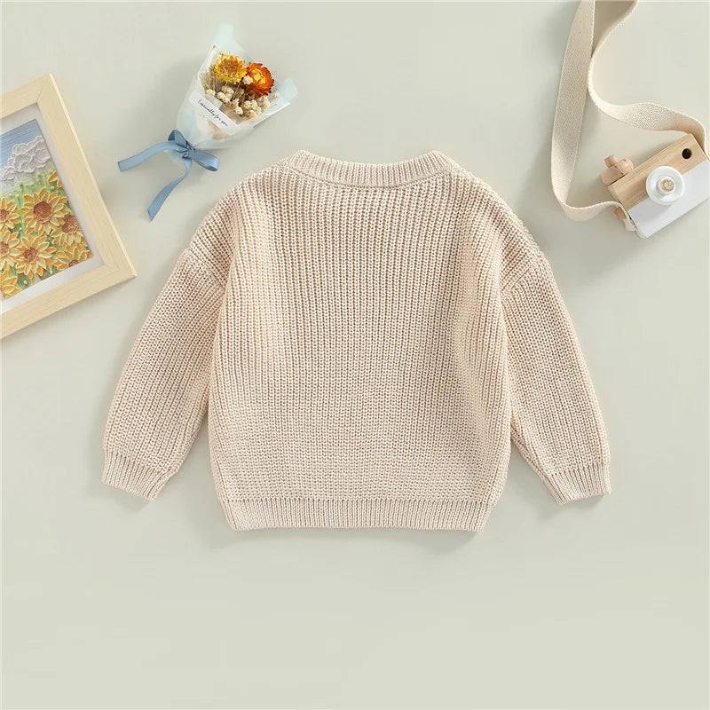 Neutral colored knitted sweaters