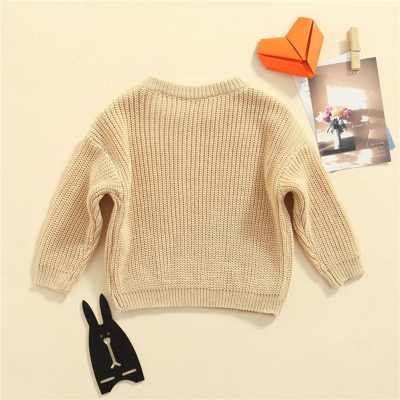 Neutral colored knitted sweaters