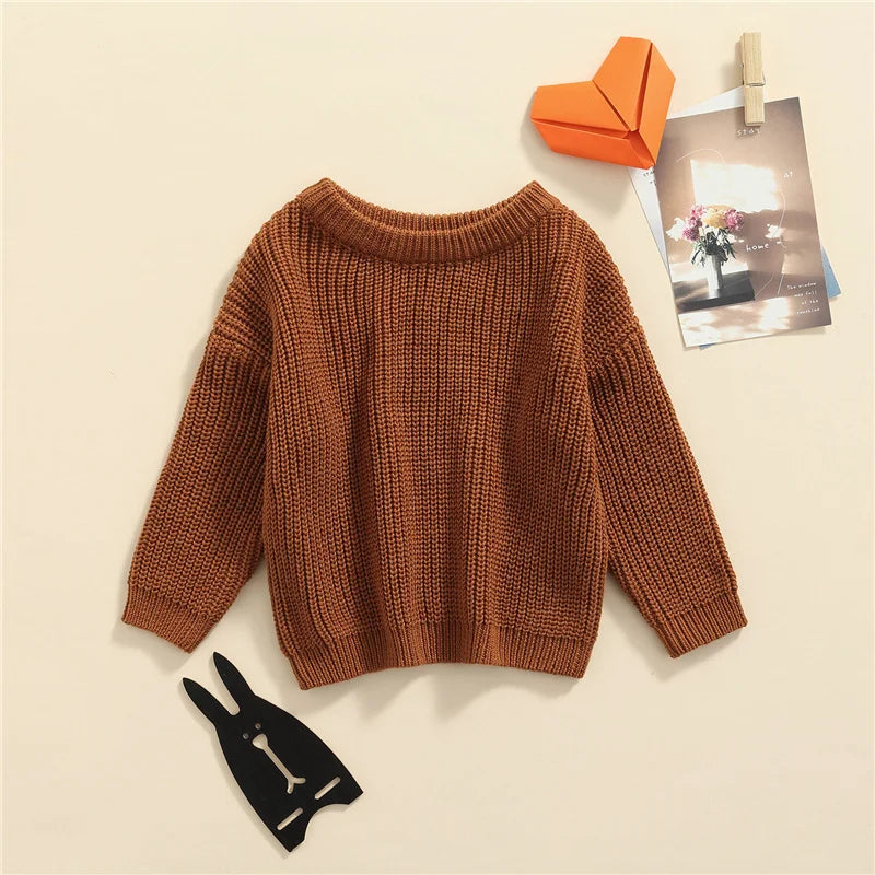 Neutral colored knitted sweaters