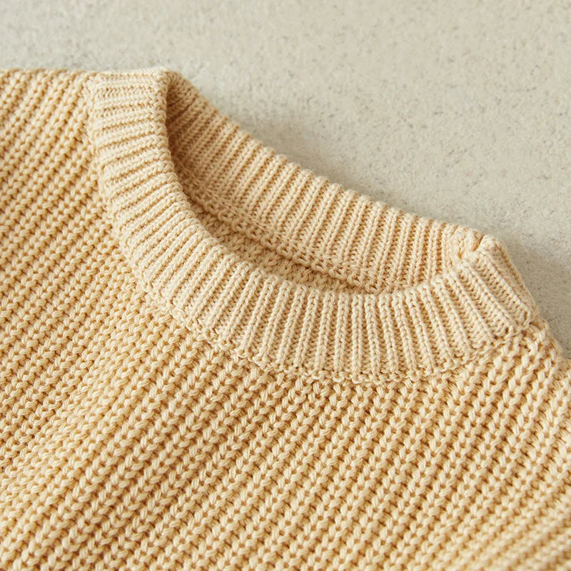 Neutral colored knitted sweaters