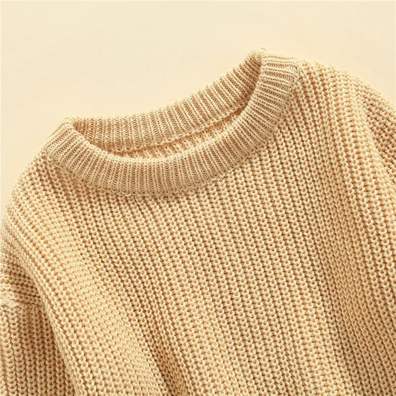 Neutral colored knitted sweaters