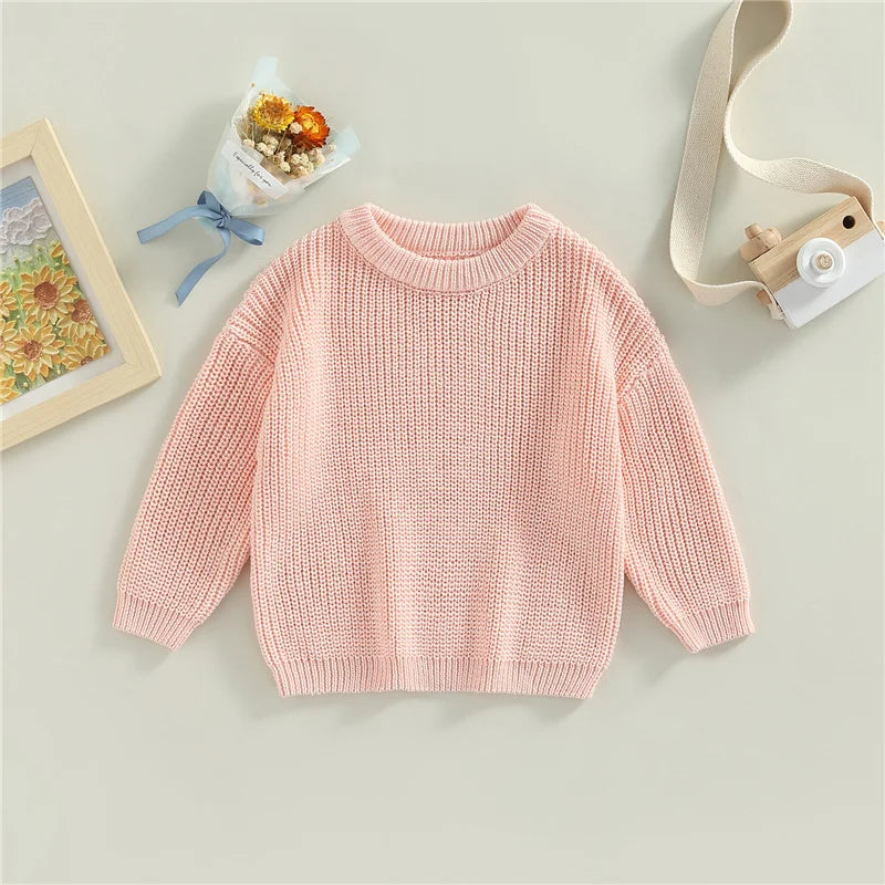 Neutral colored knitted sweaters