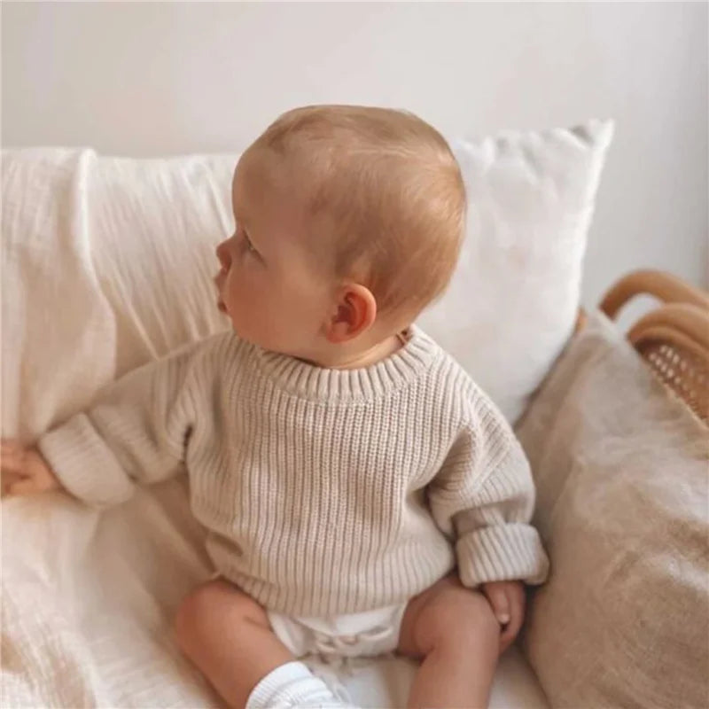 Neutral colored knitted sweaters