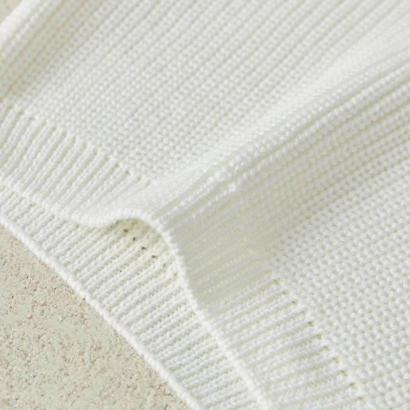 Neutral colored knitted sweaters