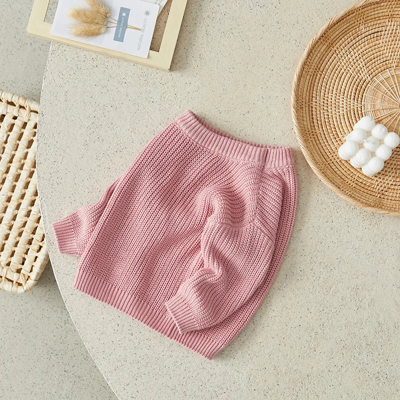 Neutral colored knitted sweaters
