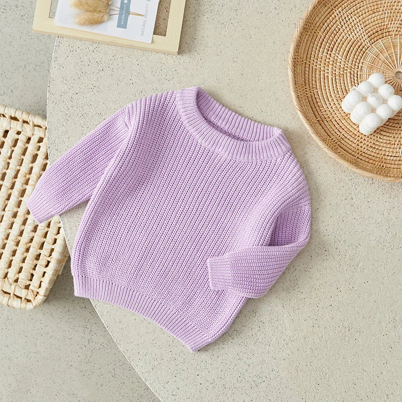 Neutral colored knitted sweaters