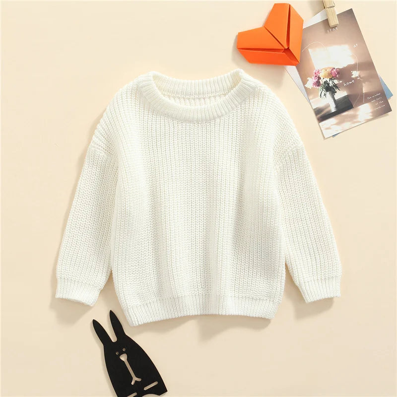 Neutral colored knitted sweaters
