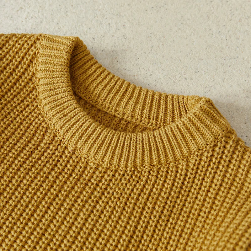 Neutral colored knitted sweaters