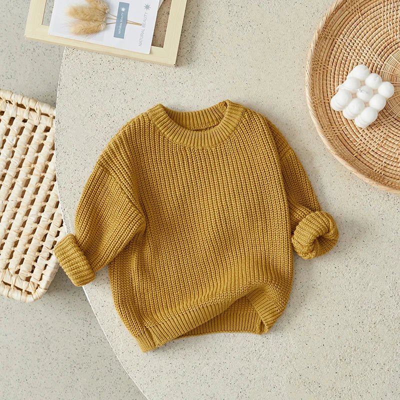 Neutral colored knitted sweaters