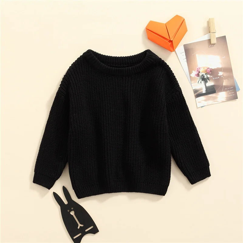Neutral colored knitted sweaters