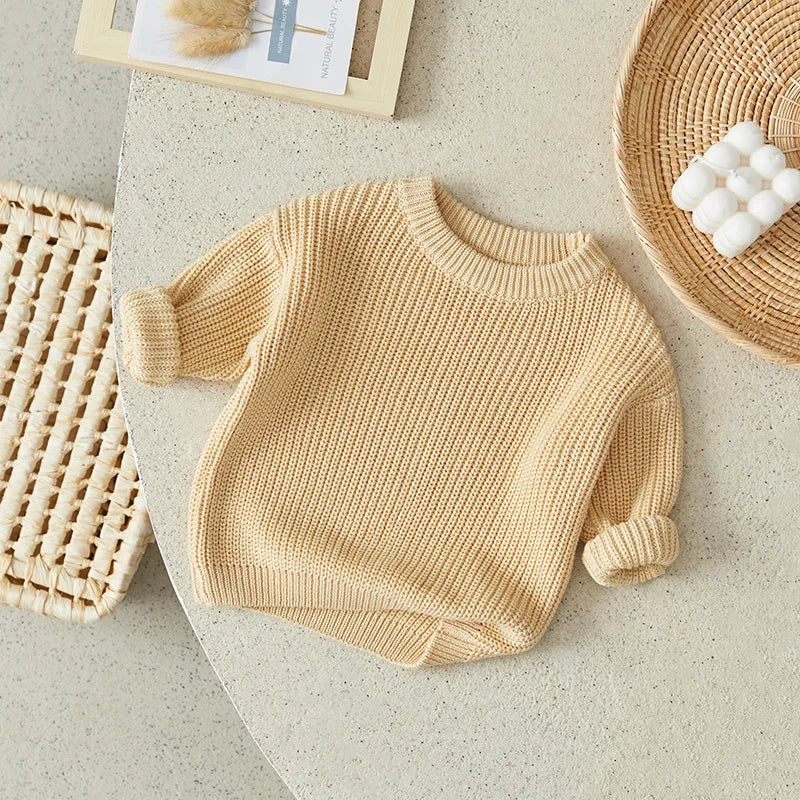 Neutral colored knitted sweaters