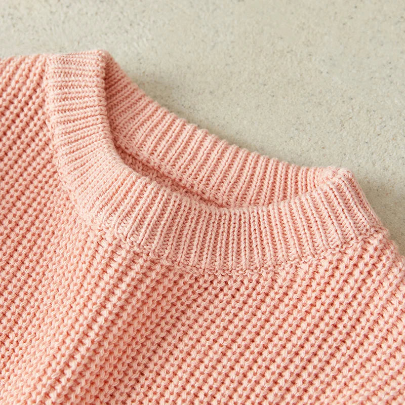 Neutral colored knitted sweaters